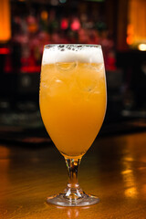 One glass of beer with lemon German beer cocktail