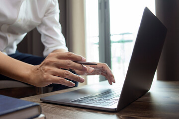Closeup hands business working at office, Man typing keyboard on laptop or computer