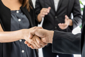 Obraz premium Partnership. business man investor team handshake deal with partner after finishing up business meeting on desk in meeting room office, financial, teamwork, contract agreement concept
