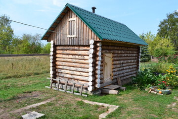 wooden bathhouse in the garden