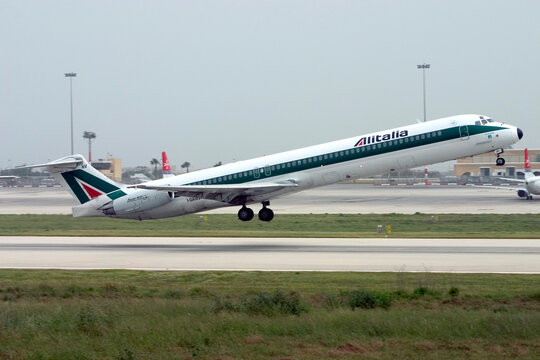 Luqa, Malta - April 10, 2005: Alitalia McDonnell Douglas MD-82 (DC-9-82) (Reg.: I-DANV) taking off on a cloudy day.