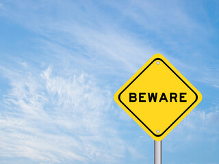 Yellow transportation sign with word beware on blue sky background