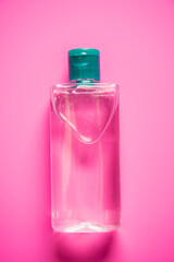 Coronavirus prevention hand sanitizer gel on table. Hand hygiene concept. Corona virus protection on yellow background.