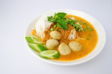 Food rice noodles with fish curry sauce on white dish on white background.