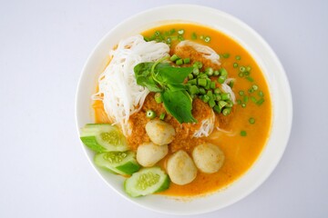 Food rice noodles with fish curry sauce on white dish on white background.