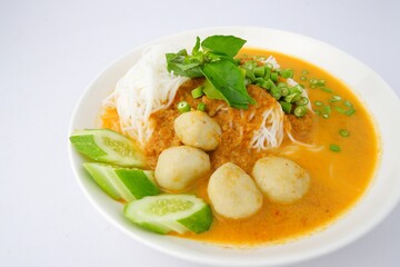 Food rice noodles with fish curry sauce on white dish on white background.