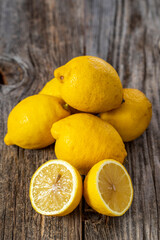 fresh ripe lemons on wood background
