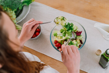 woman preparing a salad in the kitchen