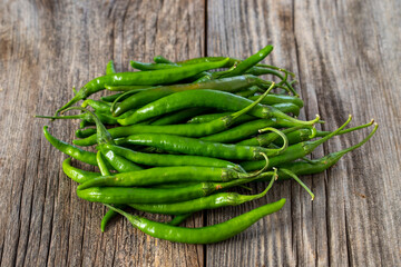 fresh ripe green pepper on wood background