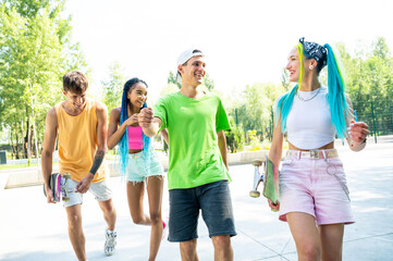 Group of professional skaters teens at the skatepark