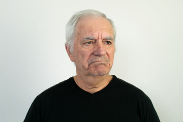 old male senior black shirt sad unhappy depression face expression frowning