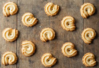 butter cookies stacked on a wood table background
