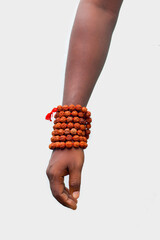 hand with Rudraksha beads for chanting.