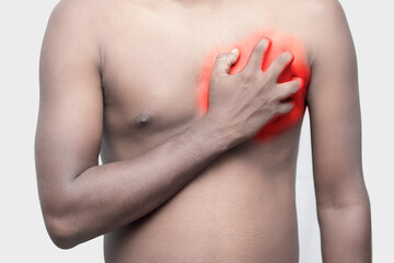 Fototapeta na wymiar a black man holding his chest by hand for chest pain.