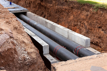 Insulated pipes in the trench. Water main reconstruction and replacement.