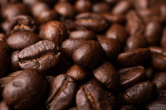 Close up of group black coffee beans. Strong black espresso, Grounds of coffee background, texture © Prot
