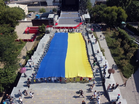 Activists carry a large flag of Ukraine along the Potemkin Stairs. Photo taken from a drone - Powered by Adobe