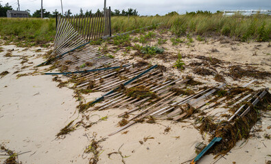 Storm damaged sand fence on the beach
