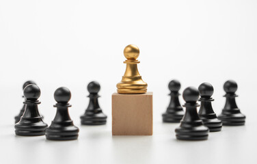 The leadership of the Golden Chess pawn standing on the box show influence and empowerment. Concept of business leadership for leader team, successful competition winner and Leader with strategy