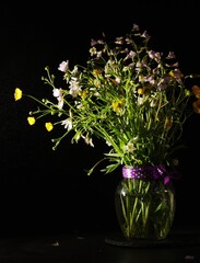 A bouquet of wild flowers in low key