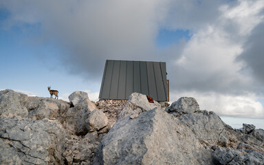 Obraz na płótnie Canvas Panorama view on Bivouac Luca Vuerich is a mountain shelter for mountaineers and hikers, located at an altitude of 2,531 meters in the Julian Alps, Italy.