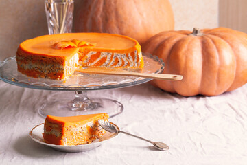 Homemade cottage cheese and pumpkin striped casserole with poppy seeds and orange and cut piece and...