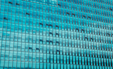 Closeup of skyscraper in USA. Modern architecture with blue glass