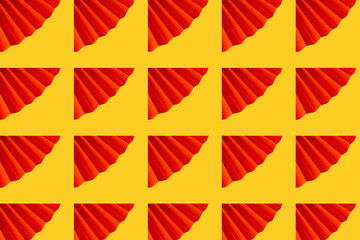Graphic pattern concept. Origami made of red paper on a yellow background. 