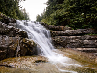small falls on the way to keekwulee falls in washington state on a cloudy day 