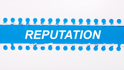 On a blue background with text REPUTATION two white torn strips of paper.
