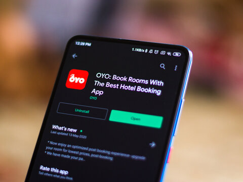 Assam, India - August 6, 2021 : Oyo logo on phone screen stock image.