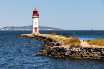 The Les Onglous lighthouse, terminating point of the Canal du Midi where the it enters the Etang de...