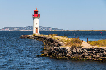 The Les Onglous lighthouse, terminating point of the Canal du Midi where the it enters the Etang de Thau. World Heritage Site. Agde, France