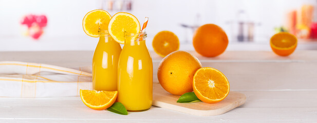 Orange juice drink in bottle on wooden board panorama copyspace copy space
