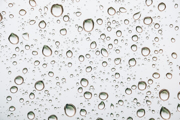 Water drops on glass, close up. background