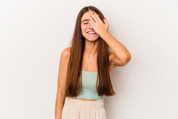 Young caucasian woman isolated on white background laughing happy, carefree, natural emotion.