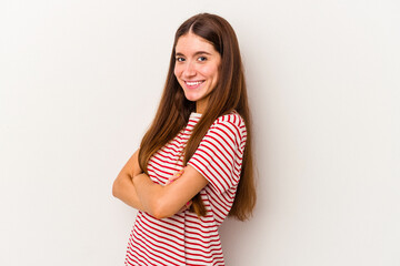 Young caucasian woman isolated on white background who feels confident, crossing arms with determination.