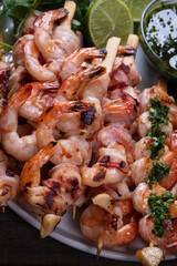 Seafood: shrimp in bacon and shrimp with garlic and herbs on skewers