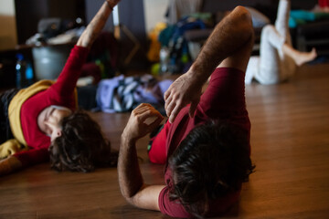 several dancers move in contact improvisation performance - obrazy, fototapety, plakaty