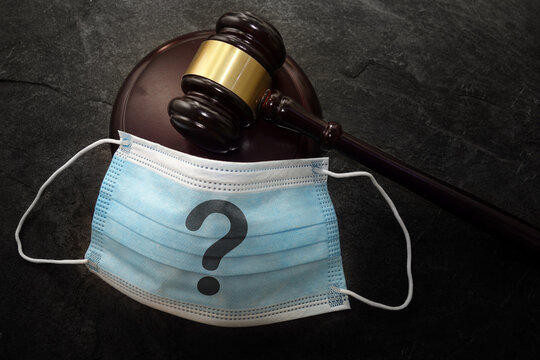 Court legal gavel and facemask with quetionmark -- Coronavirus mask mandate concept