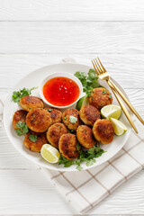 Tod man pla, thai fish cakes on a plate