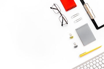 Working place mock up with computer keyboard and notepad. Top view