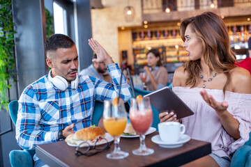 Young man and woman in cafe