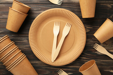 Eco friendly disposable tableware on a brown background