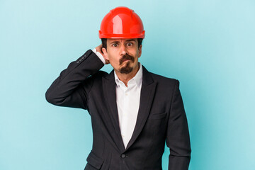 Young architect caucasian man isolated on blue background being shocked, she has remembered important meeting.