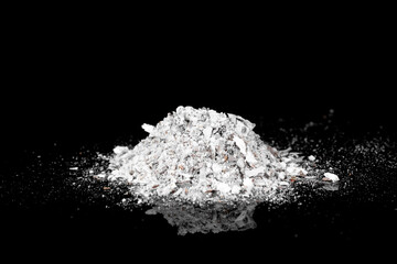 Pile of ash isolated on black background.