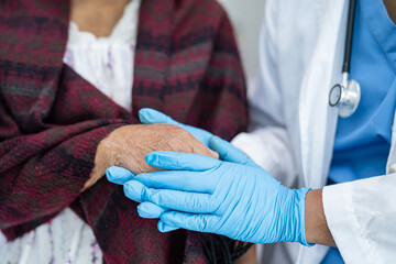 Doctor holding touching hands Asian senior or elderly old lady woman patient with love, care,...