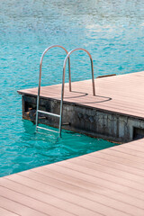 floating dock with composite deck and ladder at the marina. © yalcinsonat