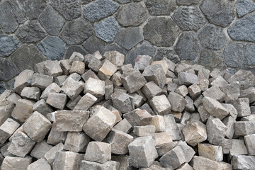 Gray stones cobblestones for pavement construction road in a heap.