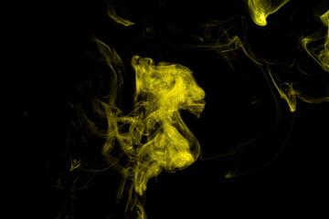 Yellow smoke abstract on black background, yellow cloud of steam on dark background